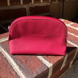 Longchamp fuchsia leather cosmetic pouch